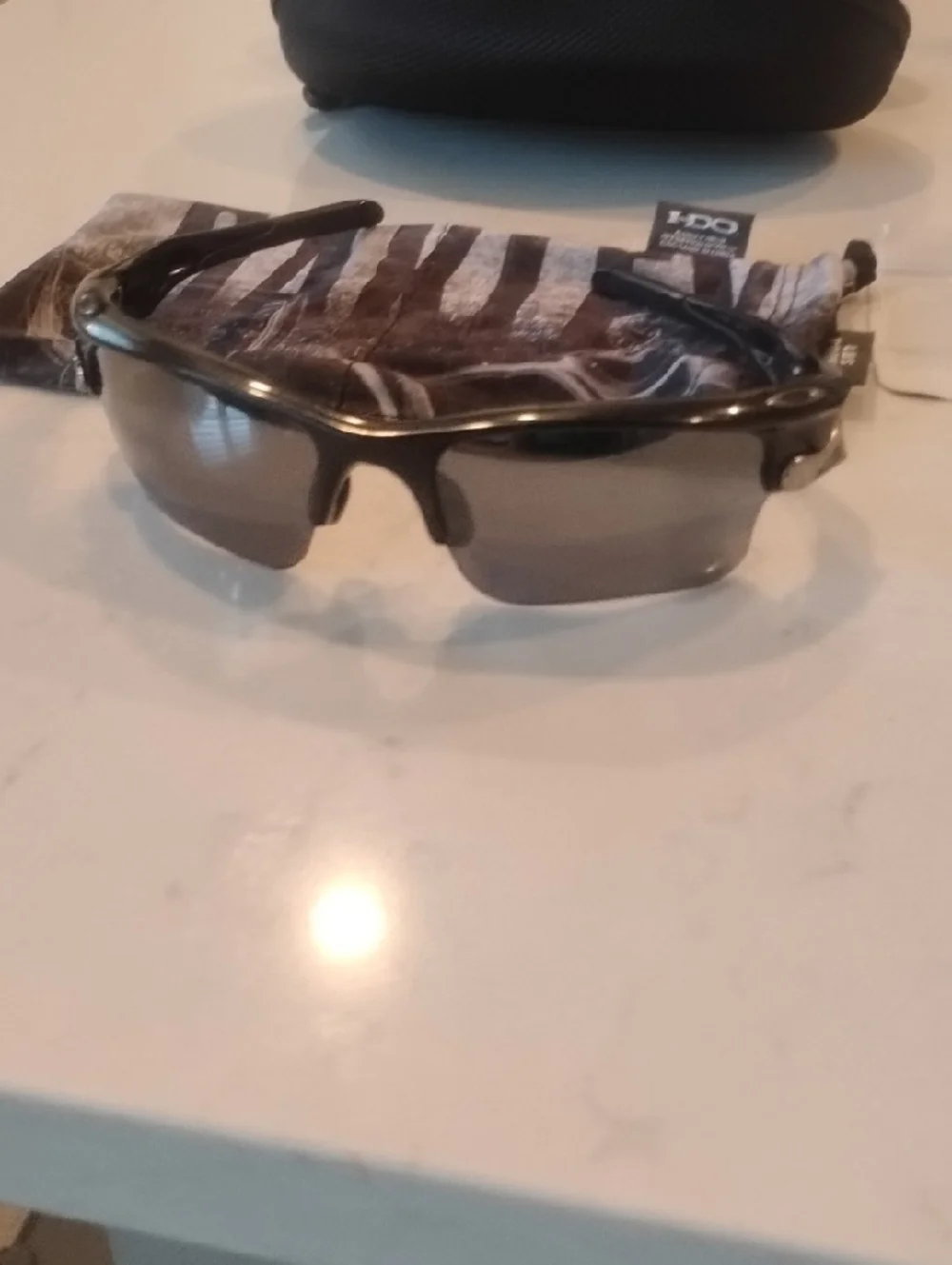 Oakley Black Frame Sunglasses with Gray And Orange Lenses